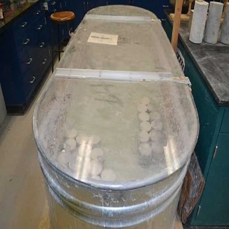 concrete specimens sitting in limewater