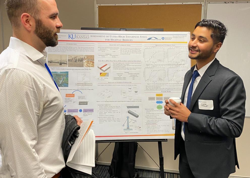 Student presenting research to attendee 