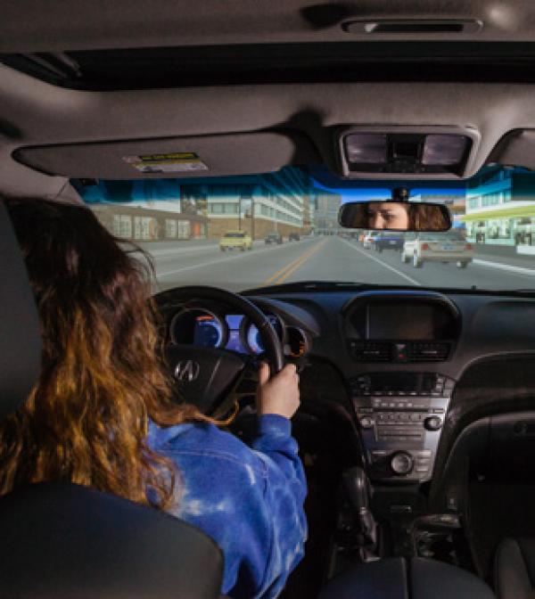 person in a driving simulator