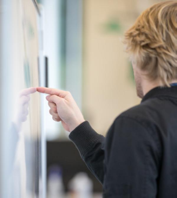 a person at a whiteboard